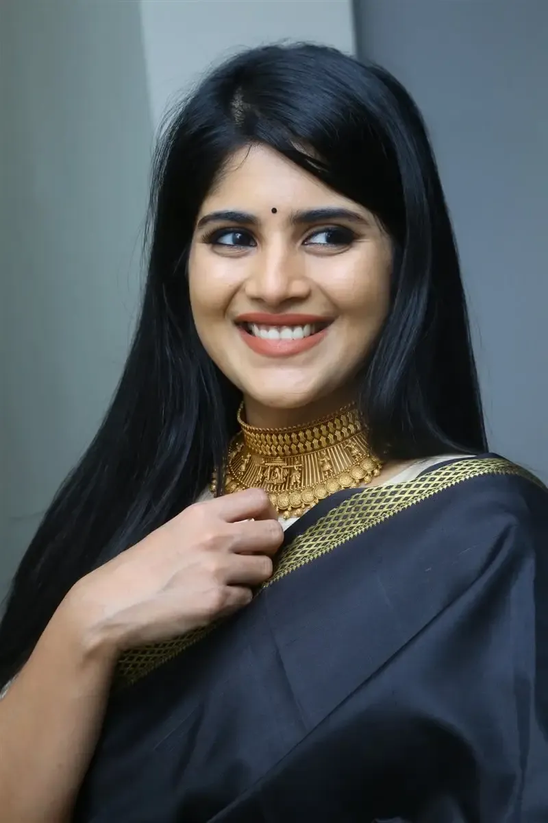 Megha Akash in Black Saree at Manu Charitra Telugu Movie Trailer Launch